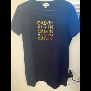 Calvin klein black and gold mini dress Size L used only a few times